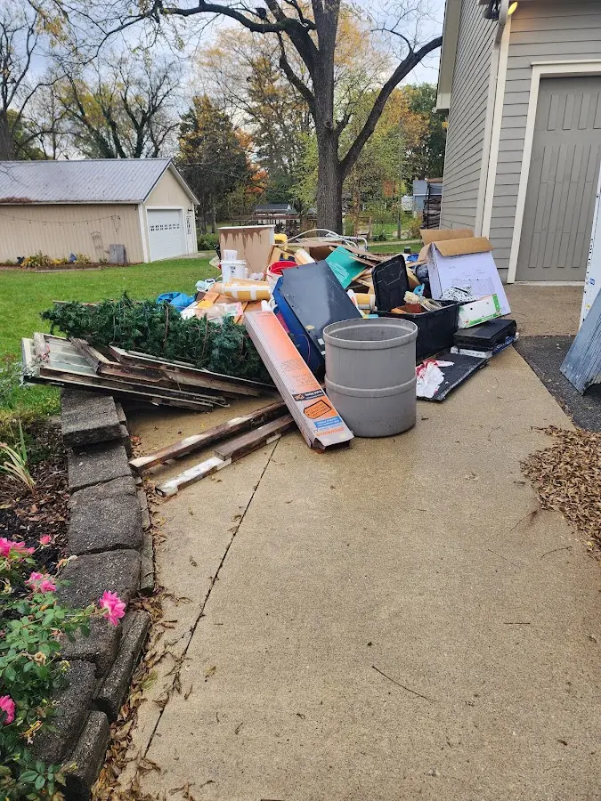 Dumpster being loaded with debris for Residential Dumpster Rental in Buckingham